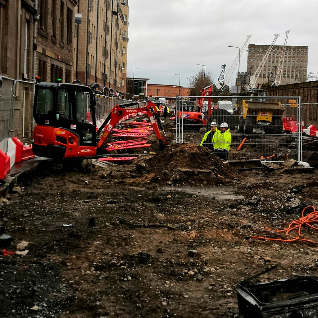 Building work on city road in Scotland with Moving Vehicles