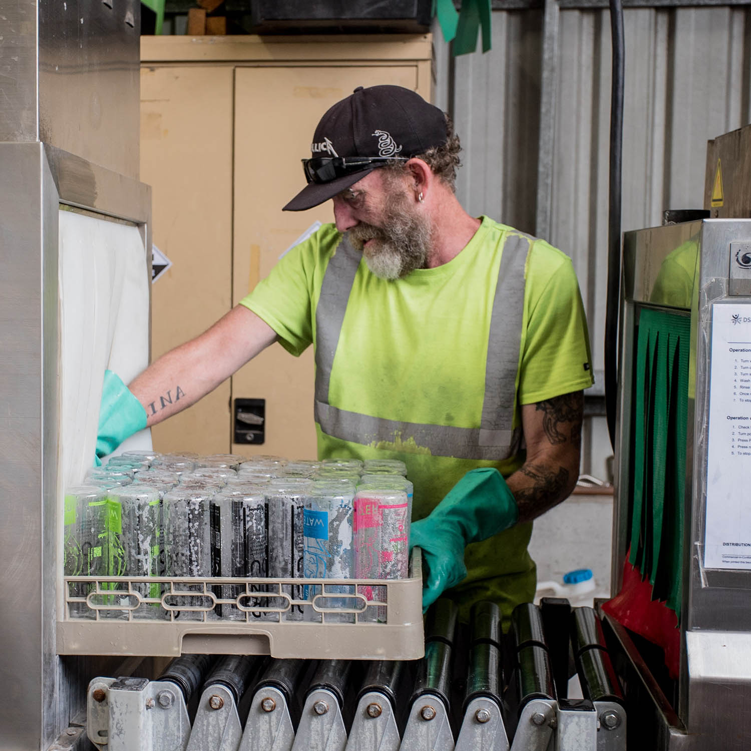 Recycling worker handling glass, waste management