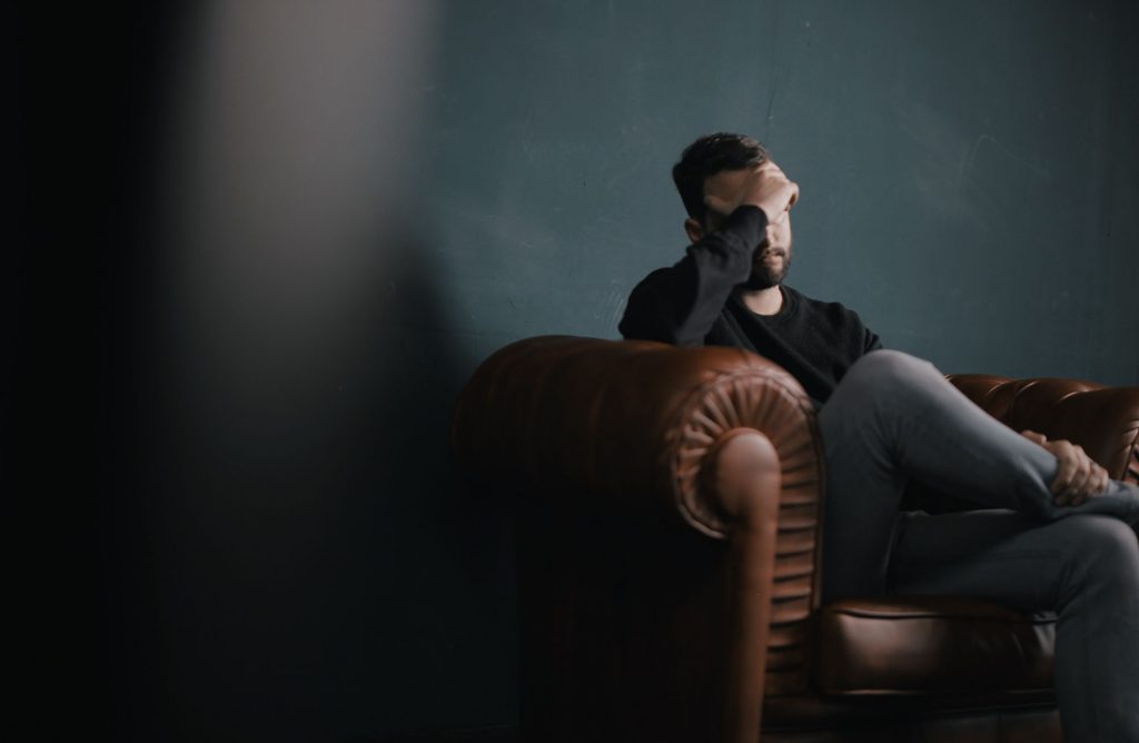 Man dealing with stress, anxiety, depression at work